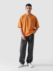 Rust Orange Washed Blank Tee Male Model Full Body Front – GROOVY Pakistan