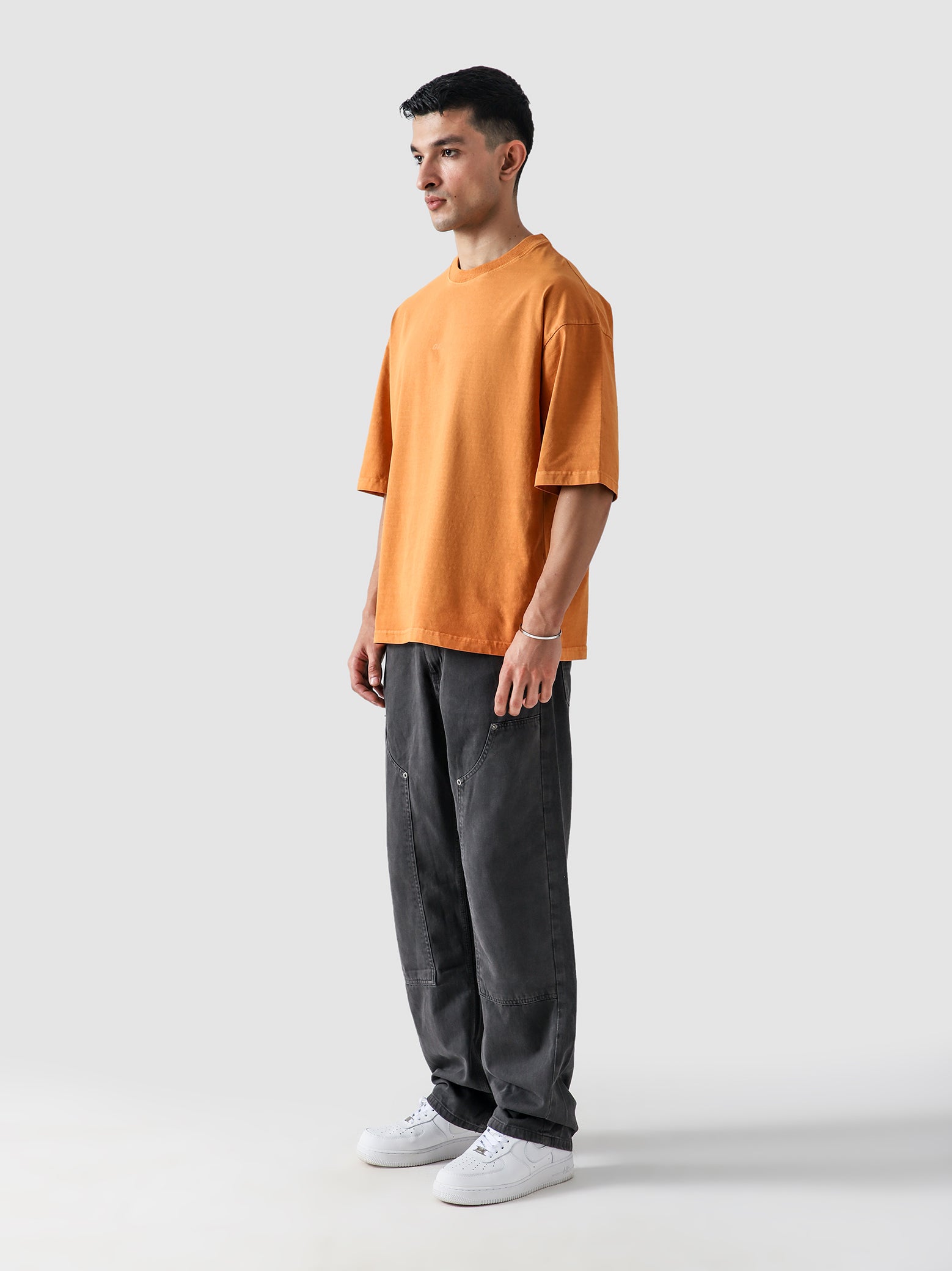 Rust Orange Washed Blank Tee Male Model Outdoor Lifestyle – GROOVY Pakistan