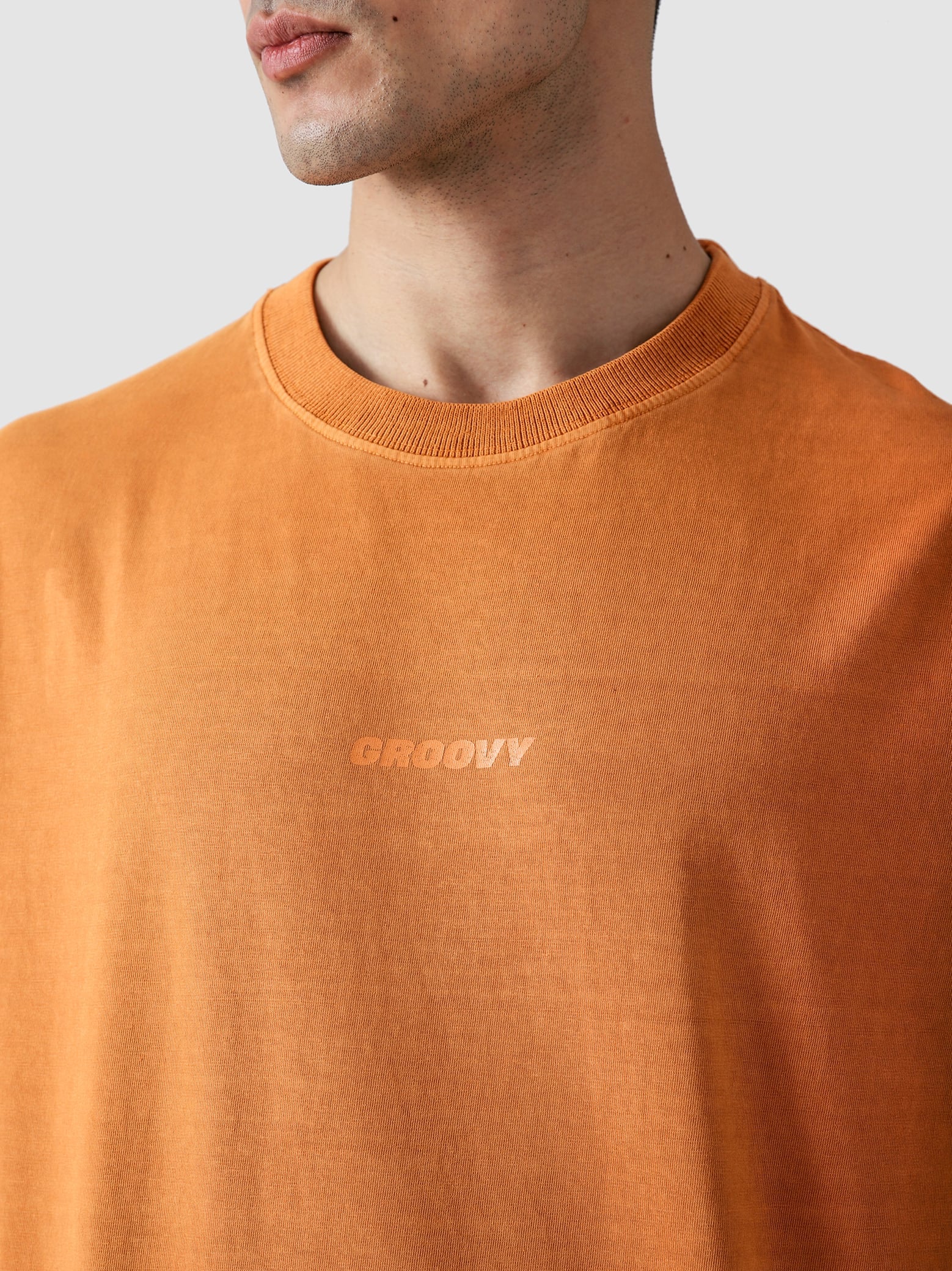 Rust Orange Washed Blank Tee Couple Lifestyle Shot – GROOVY Pakistan
