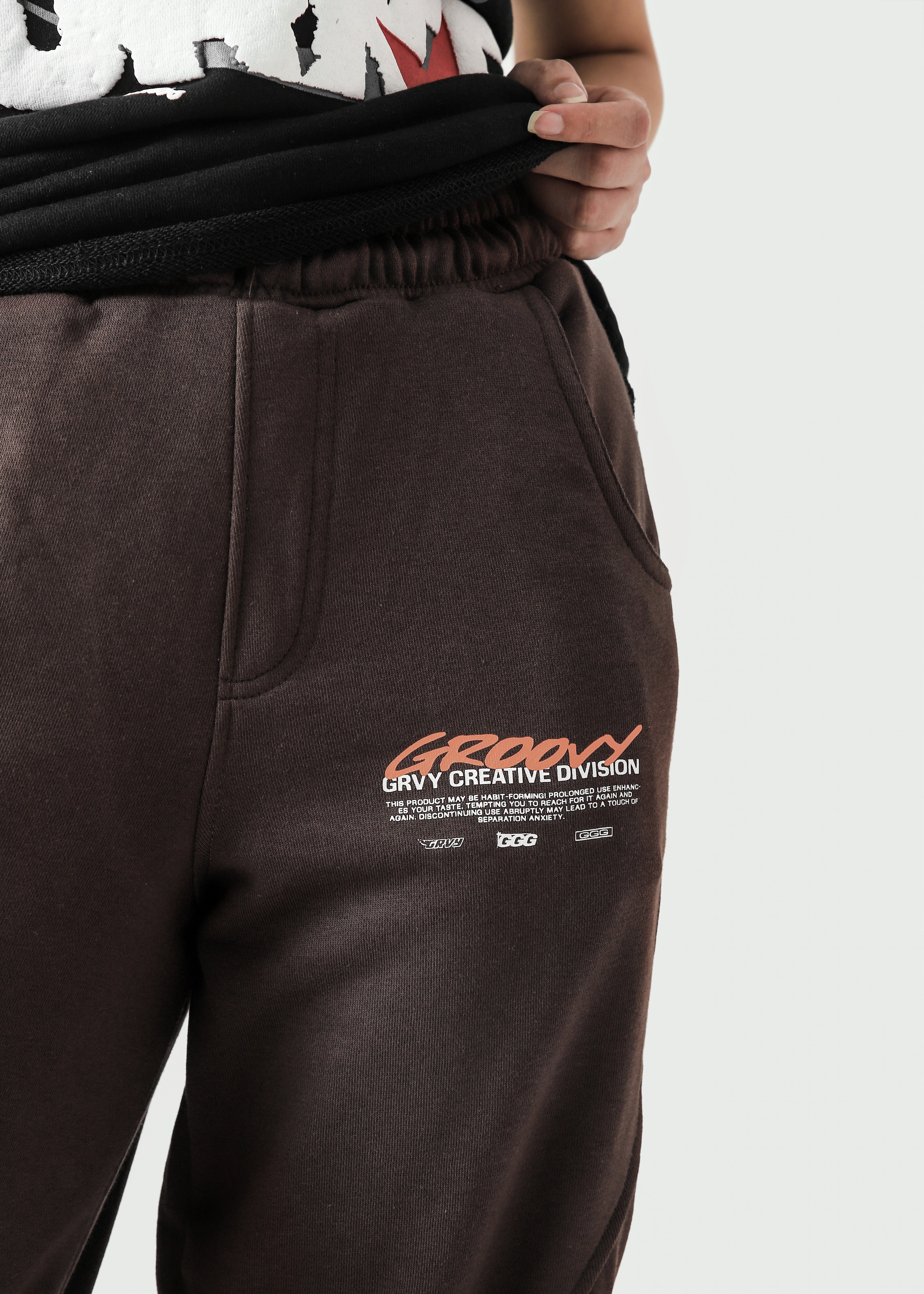 Mocha brown Unity VI pants female model side view full body Pakistan – GROOVY