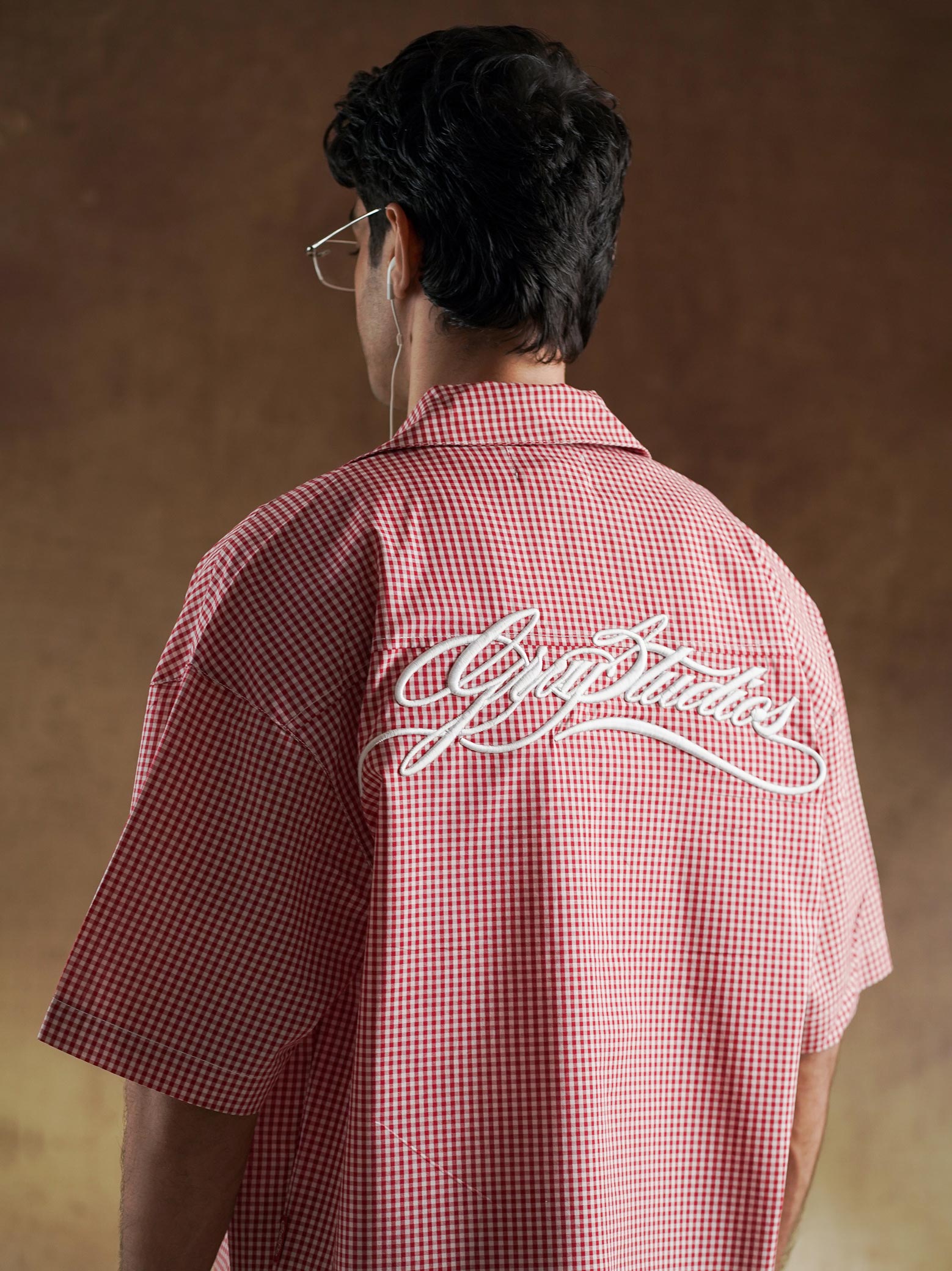 Button detail on red and white gingham shirting - GROOVY Pakistan