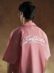 Button detail on red and white gingham shirting - GROOVY Pakistan