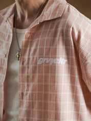 White star print detail on salmon plaid - GROOVY Pakistan