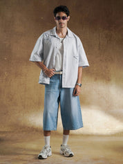 Grey denim shirt worn open over a white tank - GROOVY Pakistan