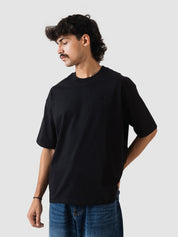 black oversized t-shirt from GROOVY, embroidered logo, made in Pakistan