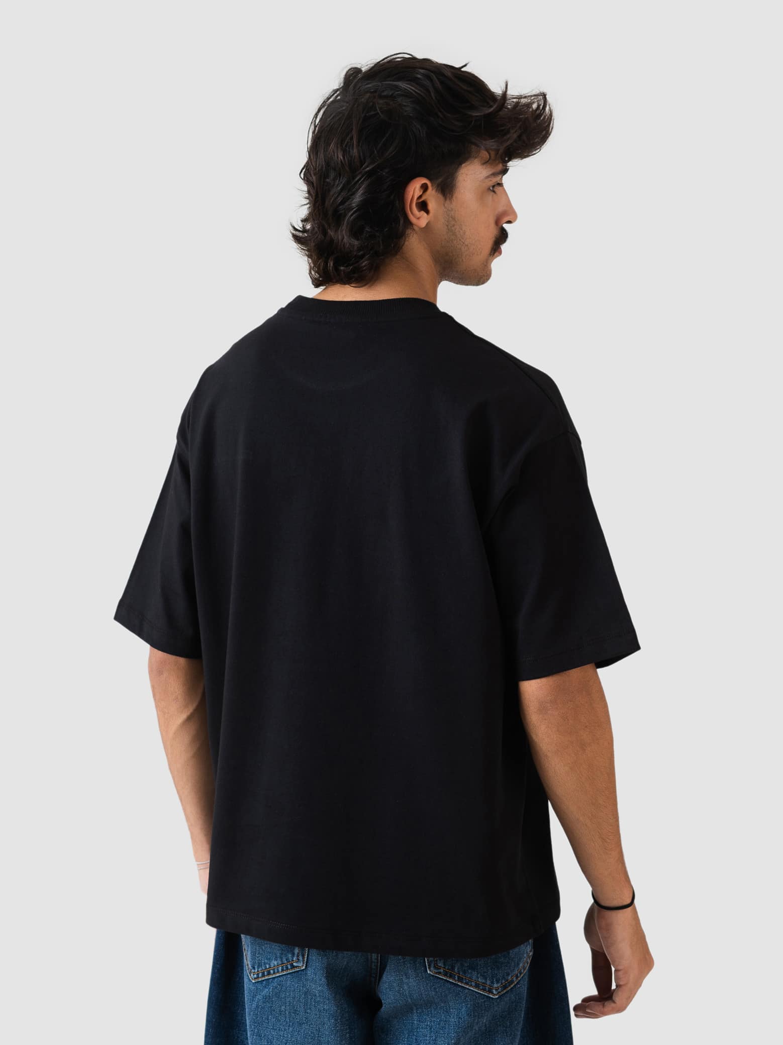 black oversized t-shirt by GROOVY Pakistan, embroidered logo